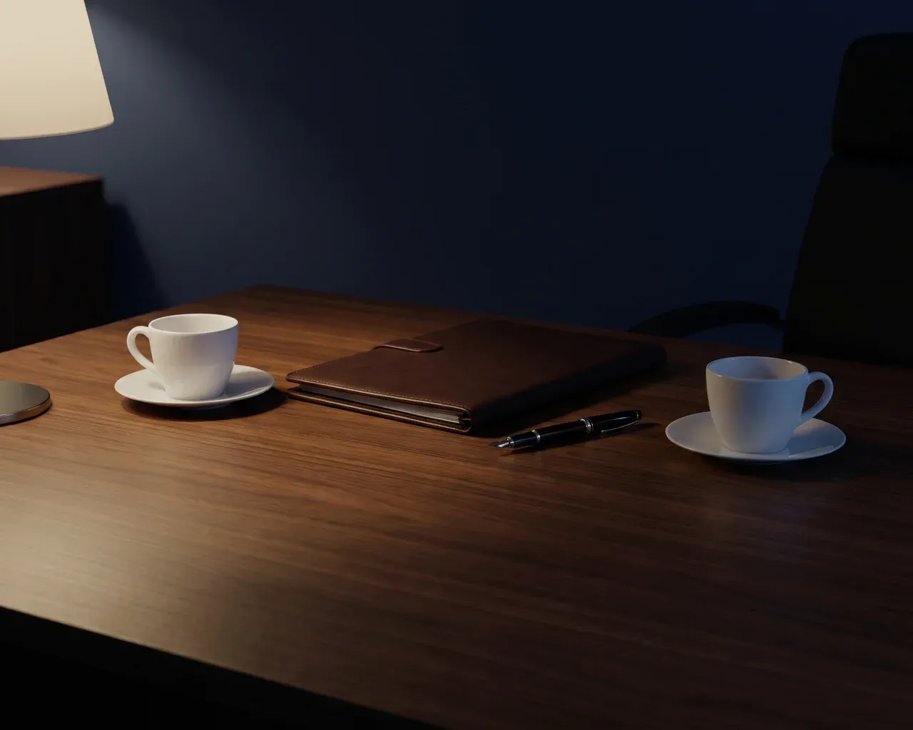 Two coffee cups facing each other across a dark table at evening, a leather folio and a pen between them.
